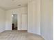 Bright main bedroom with neutral carpet and ensuite bathroom access at 2402 E 5Th St # 1472, Tempe, AZ 85288