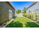 A lush lawn provides a great play area in this backyard at 2743 E Virginia St, Gilbert, AZ 85296
