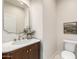 Elegant powder room features marble countertop, gold fixtures, and decorative mirror at 2743 E Virginia St, Gilbert, AZ 85296