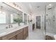 Beautiful bathroom features double vanity, white cabinets, and a glass enclosed shower at 2743 E Virginia St, Gilbert, AZ 85296