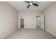 This bedroom has a ceiling fan and access to two additional rooms at 2743 E Virginia St, Gilbert, AZ 85296