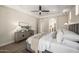 Comfortable bedroom offers a ceiling fan, and easy access to a luxurious ensuite bathroom at 2743 E Virginia St, Gilbert, AZ 85296