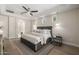 Spacious bedroom with tray ceiling, ceiling fan, and ensuite bathroom at 2743 E Virginia St, Gilbert, AZ 85296