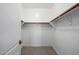 Walk-in closet with wood railing for optimal storage at 2743 E Virginia St, Gilbert, AZ 85296