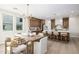 Open-concept dining room featuring modern chandelier and seamless flow to kitchen at 2743 E Virginia St, Gilbert, AZ 85296