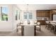 Bright dining room with natural light, modern chandelier, and wood cabinets at 2743 E Virginia St, Gilbert, AZ 85296