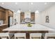 Spacious kitchen features a large marble island with seating and a modern lighting fixture at 2743 E Virginia St, Gilbert, AZ 85296