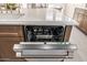 Kitchen island featuring a built-in dishwasher with a stainless steel finish and modern controls at 2743 E Virginia St, Gilbert, AZ 85296