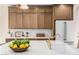 Kitchen with custom cabinetry, marble countertops, and gold-toned faucet and fixtures at 2743 E Virginia St, Gilbert, AZ 85296