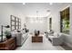 Bright living room with modern decor, chandelier, and ample natural light at 2743 E Virginia St, Gilbert, AZ 85296