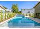 Backyard pool featuring lush landscaping and a water feature, creating a relaxing oasis at 2743 E Virginia St, Gilbert, AZ 85296