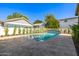 Backyard pool featuring lush landscaping and a water feature, creating a relaxing oasis at 2743 E Virginia St, Gilbert, AZ 85296