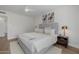 Clean bedroom features a ceiling fan, hardwood floors and large bed at 2753 E Aster Dr, Phoenix, AZ 85032