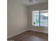 Empty bedroom with light colored walls and hardwood floors at 2753 E Aster Dr, Phoenix, AZ 85032