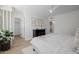 Bright bedroom features hardwood floors, a ceiling fan, and light gray colored walls at 2753 E Aster Dr, Phoenix, AZ 85032