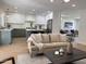 Open-concept living area and kitchen includes an island with seating at 2753 E Aster Dr, Phoenix, AZ 85032