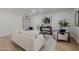 Well-lit living room features modern decor and neutral earth-tone colors at 2753 E Aster Dr, Phoenix, AZ 85032