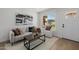 Cozy living room featuring stylish furnishings, neutral tones, and a bright window at 2753 E Aster Dr, Phoenix, AZ 85032