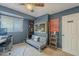 Stylish bedroom with a futon, desk, and guitar, offering a cozy and functional space at 2818 E Clarendon Ave, Phoenix, AZ 85016