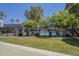 Community pool surrounded by lush green grass at 2818 E Clarendon Ave, Phoenix, AZ 85016