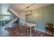 Open-concept dining area adjacent to the living room and staircase, with terra cotta tile flooring at 2818 E Clarendon Ave, Phoenix, AZ 85016