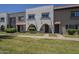 A row of townhomes with stucco exteriors and red tile accents at 2818 E Clarendon Ave, Phoenix, AZ 85016