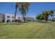 Well-maintained lawns and manicured trees surround the apartment homes at 2818 E Clarendon Ave, Phoenix, AZ 85016