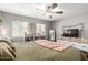 Comfortable bedroom with neutral walls, ceiling fan, and natural light from two windows at 3109 W Loma Ln, Phoenix, AZ 85051