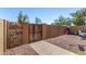 Private backyard featuring decorative block walls, a secure gate, and gravel landscaping at 3646 N 67Th Ave # 29, Phoenix, AZ 85033