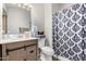 Well-maintained bathroom with modern vanity, patterned shower curtain, and fresh towels at 3646 N 67Th Ave # 29, Phoenix, AZ 85033