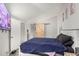 Comfortable bedroom featuring a wooden bed frame and personal touches at 3646 N 67Th Ave # 29, Phoenix, AZ 85033