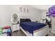Bedroom featuring a wooden bed frame and neutral decor at 3646 N 67Th Ave # 29, Phoenix, AZ 85033