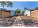 View of a walking path between homes in the community at 3646 N 67Th Ave # 29, Phoenix, AZ 85033