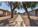 Charming exteriors and shaded sidewalks create a welcoming, walkable neighborhood atmosphere with mature trees at 3646 N 67Th Ave # 29, Phoenix, AZ 85033
