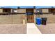 Townhouse front yard with low desert landscaping and a private front gate at 3646 N 67Th Ave # 29, Phoenix, AZ 85033