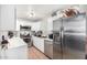 Modern kitchen featuring white cabinets, stainless steel appliances, and ample counter space at 3646 N 67Th Ave # 29, Phoenix, AZ 85033