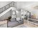 Open concept living room and dining room featuring high ceilings and staircase at 3646 N 67Th Ave # 29, Phoenix, AZ 85033