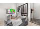 Comfortable living room with a flat-screen TV, neutral decor, and ample seating at 3646 N 67Th Ave # 29, Phoenix, AZ 85033