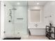 Modern bathroom featuring a glass-enclosed shower and soaking tub in a bright, clean space at 36922 N Camarillo Dr, San Tan Valley, AZ 85140