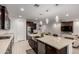 Well-equipped kitchen with an oversized island, granite countertops, and open layout at 36922 N Camarillo Dr, San Tan Valley, AZ 85140