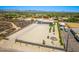 This aerial shot showcases the property's desert landscaping, a spacious lot, and a large detached garage at 38415 N 25Th Ave, Phoenix, AZ 85086