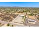 Aerial shot showcases the property's proximity to other homes, riding arena and its multi-vehicle garage at 38415 N 25Th Ave, Phoenix, AZ 85086