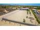 Expansive aerial view showcasing the property's large lot with desert landscaping and detached garage at 38415 N 25Th Ave, Phoenix, AZ 85086