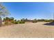 Backyard with desert landscaping and a fenced-in area at 38415 N 25Th Ave, Phoenix, AZ 85086