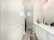 Clean bathroom with dual vanities, modern fixtures, and wood-look tile flooring at 38415 N 25Th Ave, Phoenix, AZ 85086