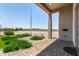 Covered home entrance with decorative pavers, desert landscaping, and architectural columns at 38415 N 25Th Ave, Phoenix, AZ 85086