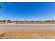 Property entrance with stone walls, desert landscaping, and an American flag at 38415 N 25Th Ave, Phoenix, AZ 85086