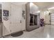 Garage features custom storage, including gray cabinets and coat rack, plus an arcade game at 38415 N 25Th Ave, Phoenix, AZ 85086