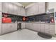 Garage with custom gray cabinets, work area and plenty of space for projects and storage at 38415 N 25Th Ave, Phoenix, AZ 85086