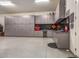 Spacious garage with epoxy floors and custom gray cabinets, providing ample storage and workspace at 38415 N 25Th Ave, Phoenix, AZ 85086